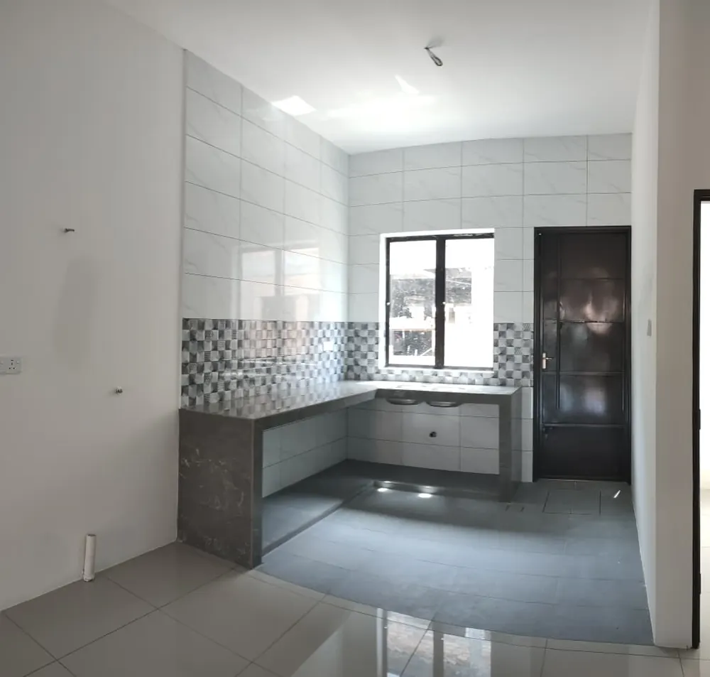 Kitchen &mdash; counter cast, tiled splashback, window over the sink