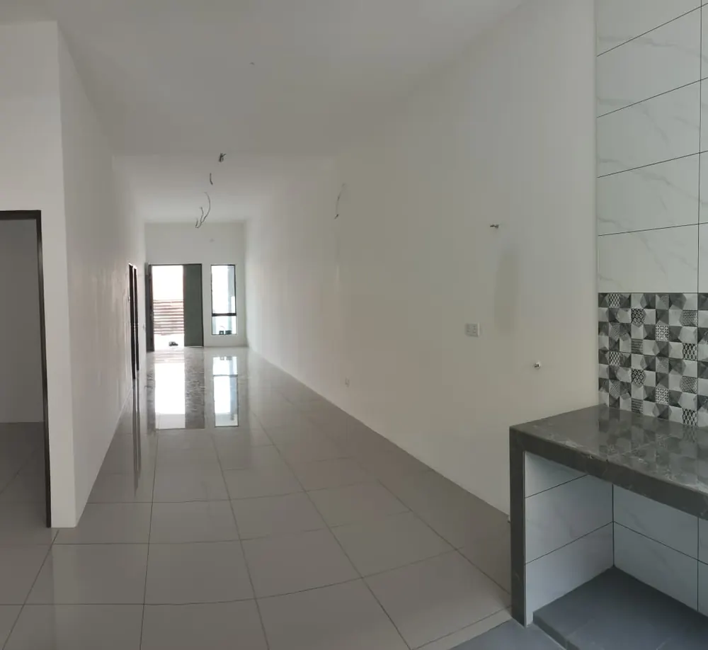 Living and dining area, with the kitchen counter beyond